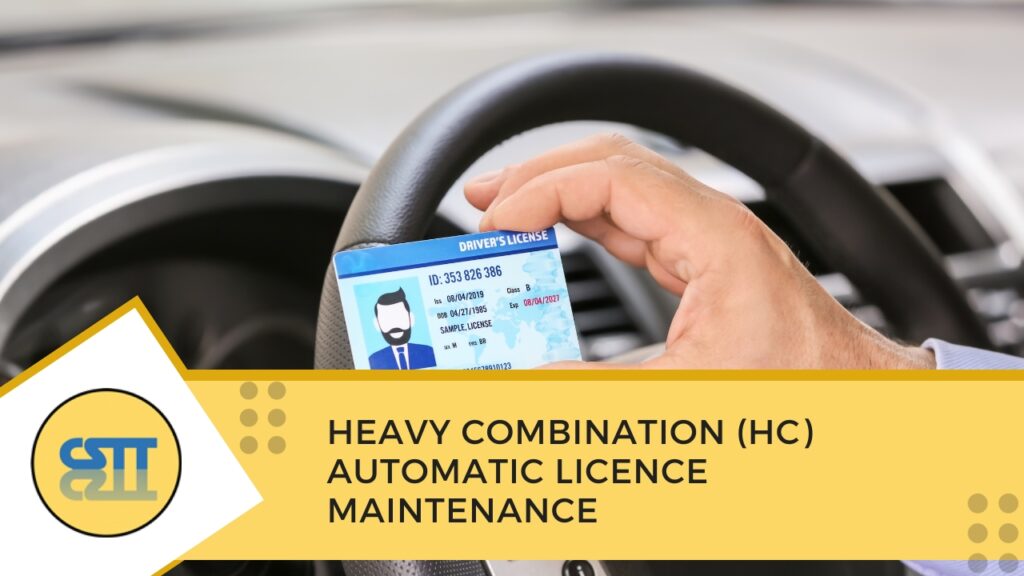 Hand holding a driver's licence in front of a vehicle steering wheel