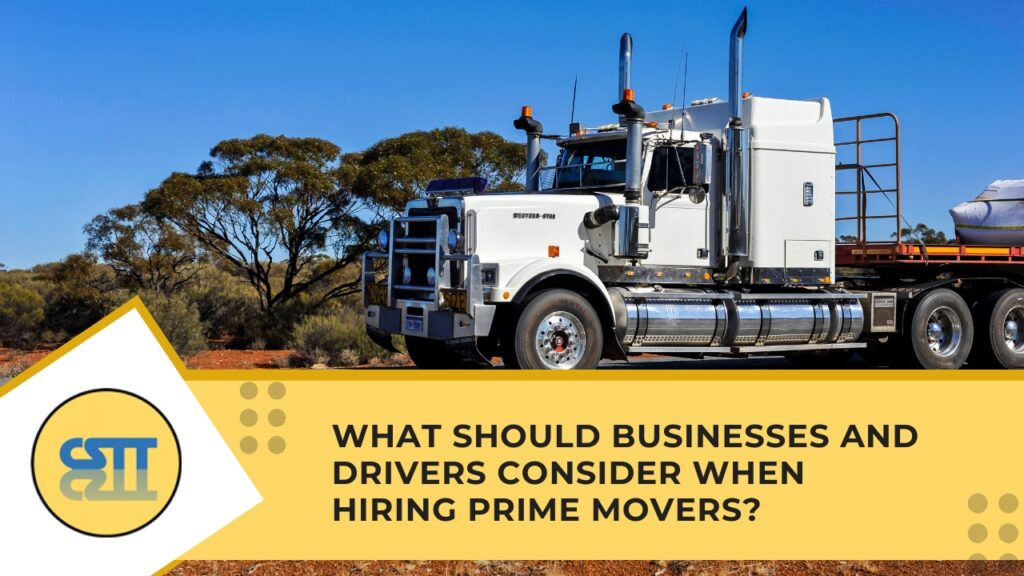 A large white Prime Movers with a bull bar driving down a remote highway through an arid landscape
